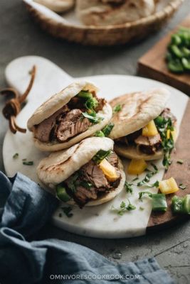  Rou Jia Mo: Un Panino Rustico con Carne di Maiale Speziata che Stimola i Sensi!